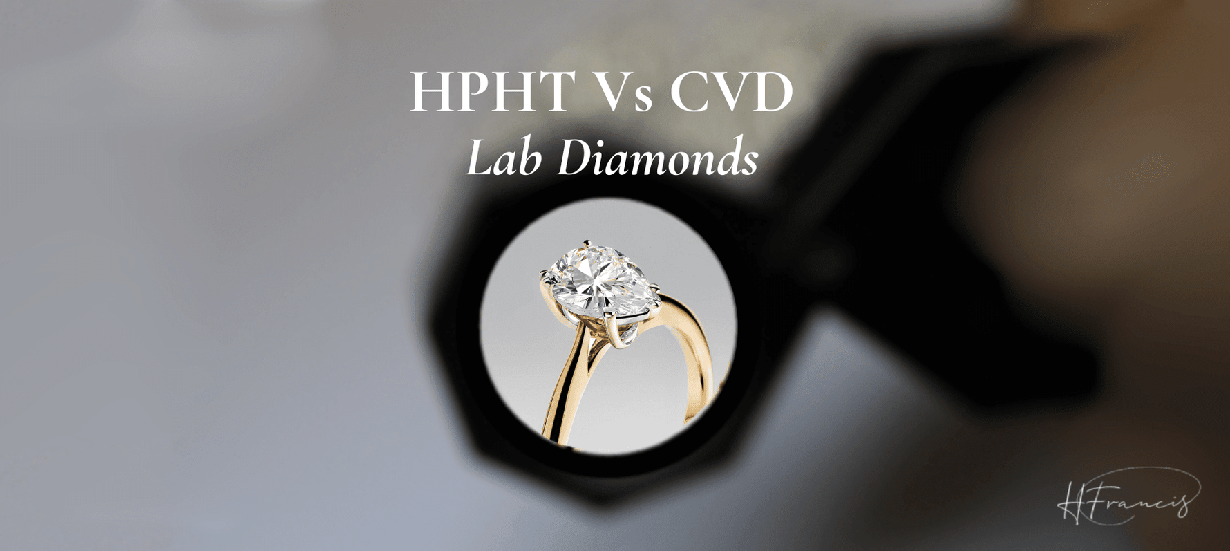 HPHT Vs CVD Lab Diamonds — pear solitaire ring seen through a jeweler's loupe; signature