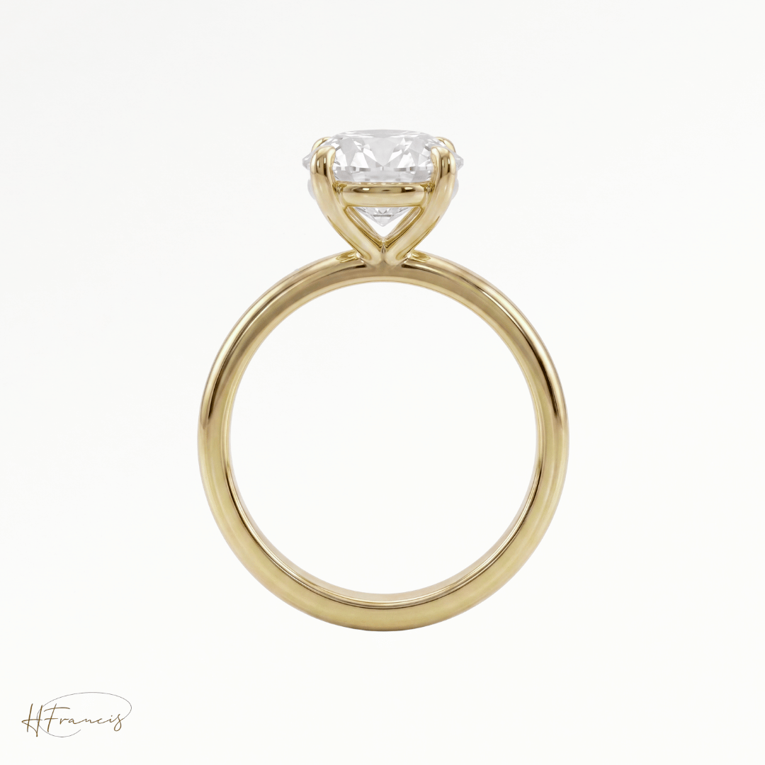 Round classic solitaire engagement ring in 18k yellow gold front view 