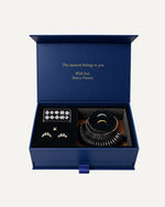 The At-Home Ring Try-On Kit open, showing ten stone shapes, three setting styles, a ring sizer and two try-on bands