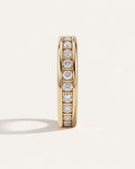 Dual Rail Diamond Eternity Band standing upright, showing the line of round diamonds and gold pillars between the rails