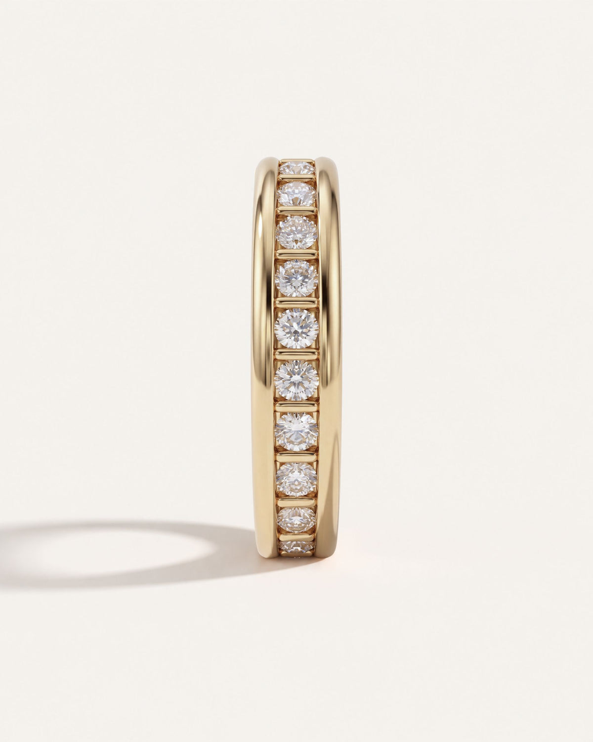 Dual Rail Diamond Eternity Band standing upright, showing the line of round diamonds and gold pillars between the rails