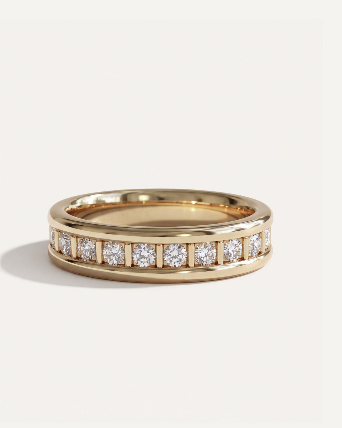Dual Rail Diamond Eternity Band in 14k yellow gold, round diamonds separated by gold pillars between two polished rails