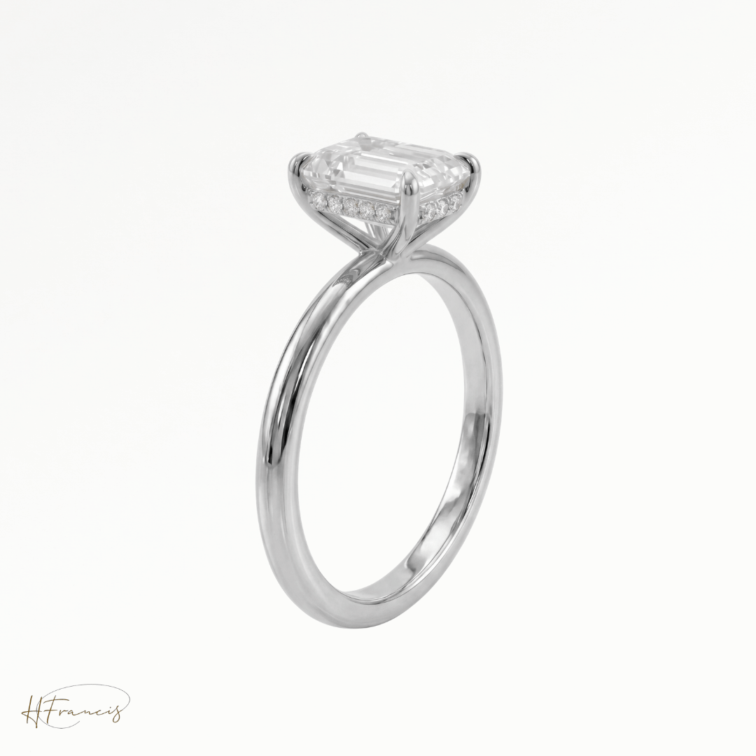 Emerald classic solitaire engagement ring in Platinum 