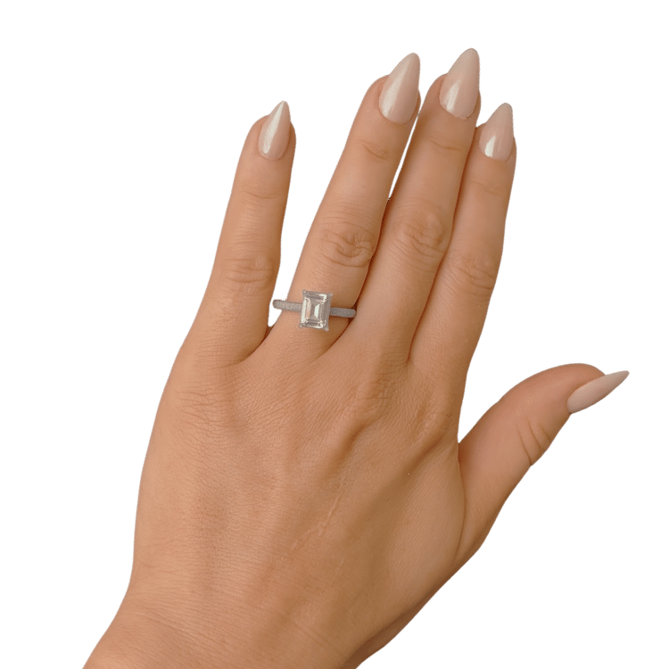 Printed emerald-cut stone worn on the hand for at-home size comparison