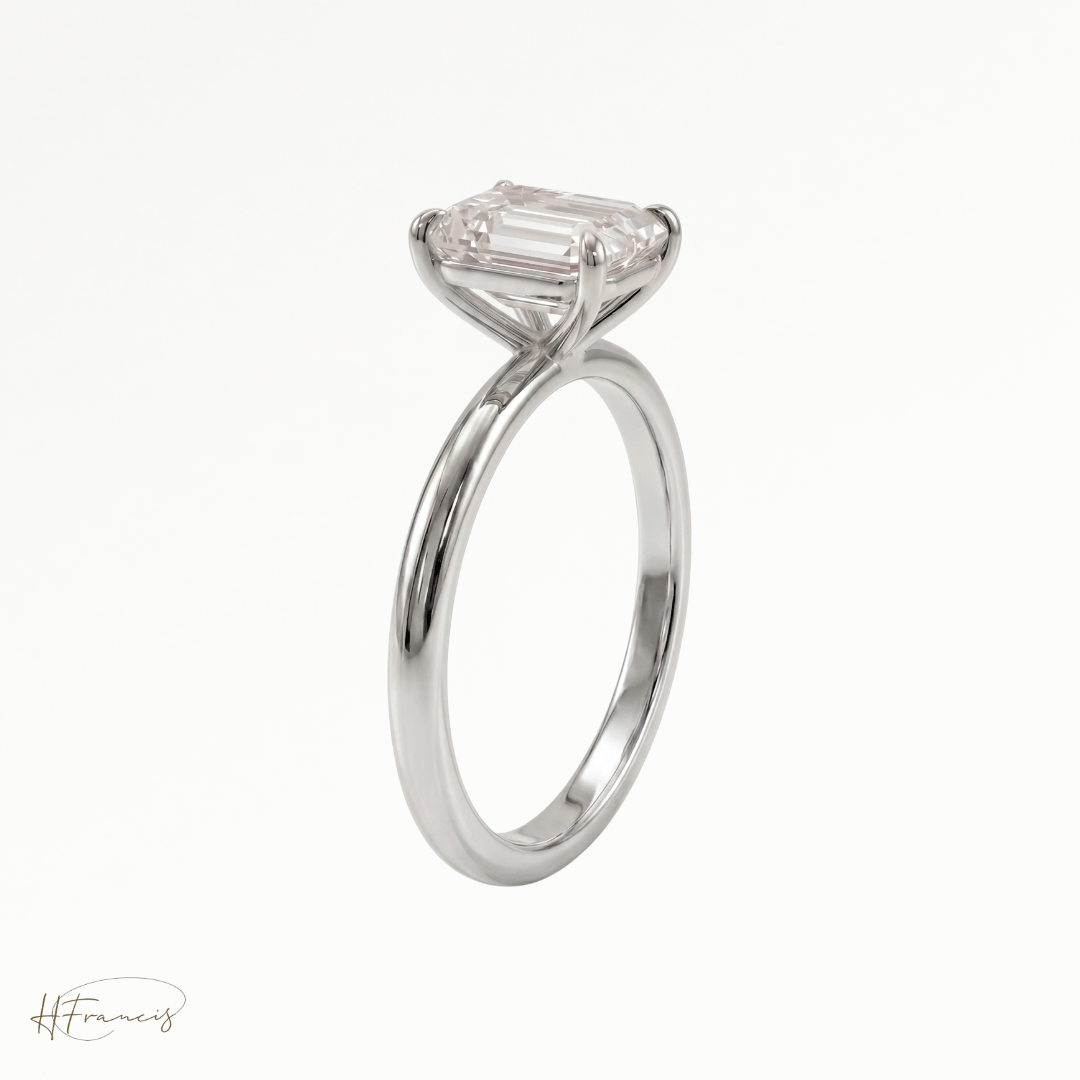 Emerald classic solitaire engagement ring in Platinum 