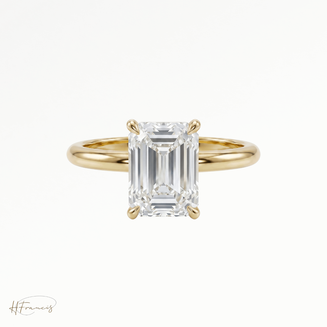 Emerald classic solitaire engagement ring in 18k yellow gold 