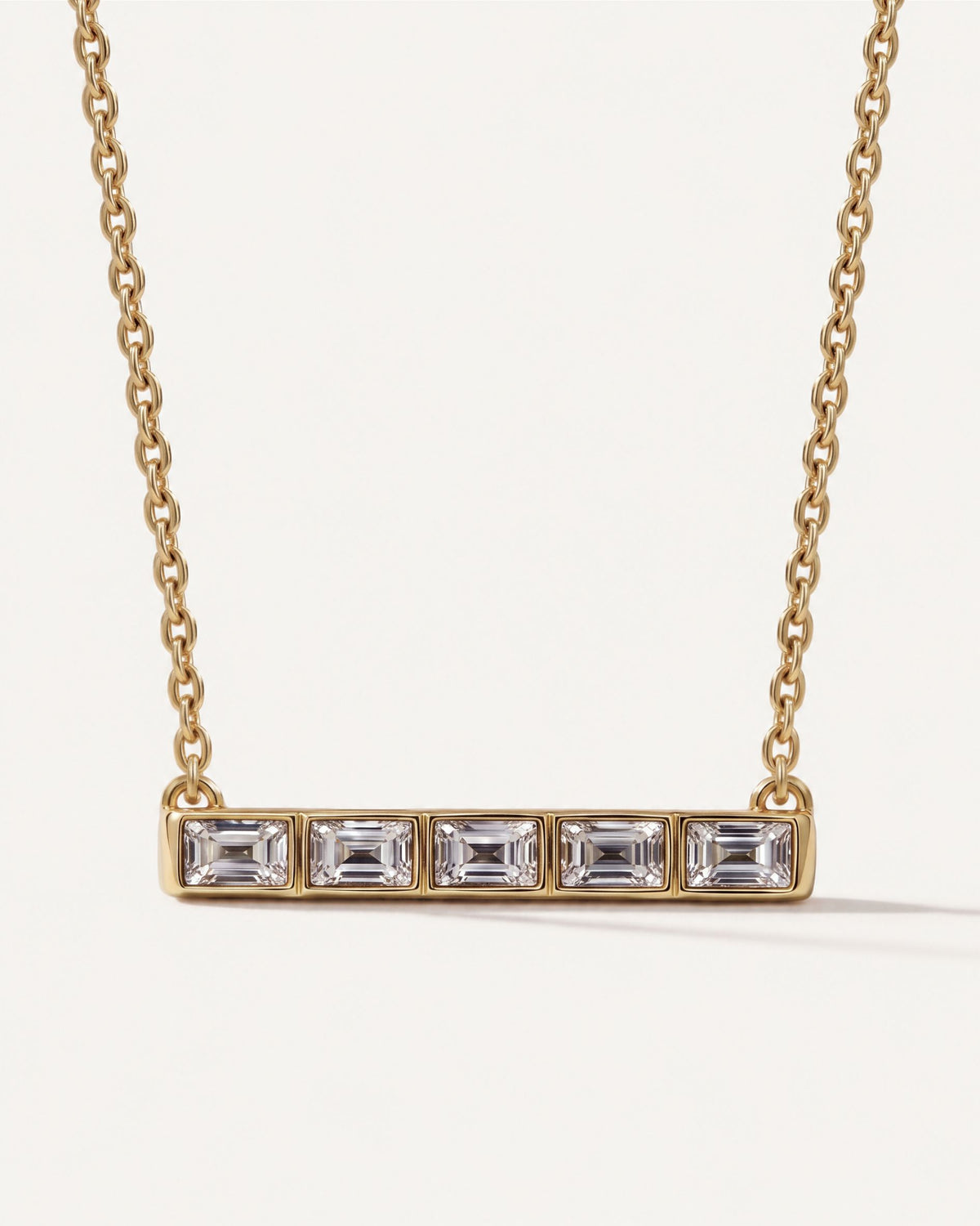 Five-Stone Emerald Diamond Bar Necklace in 14k yellow gold, five emerald-cut diamonds in a row of bezels on a cable chain