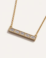 Back of the Five-Stone Emerald Diamond Bar Necklace, showing the open bezels behind each emerald-cut diamond