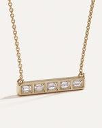 Back of the Five-Stone Emerald Diamond Bar Necklace, showing the open bezels behind each emerald-cut diamond