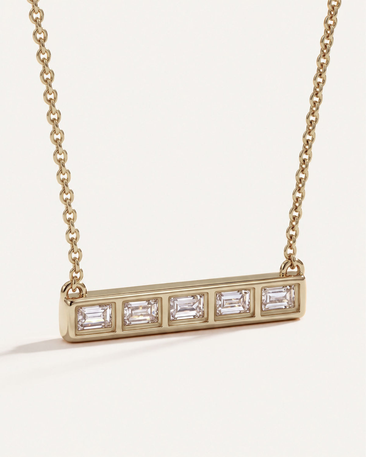 Back of the Five-Stone Emerald Diamond Bar Necklace, showing the open bezels behind each emerald-cut diamond