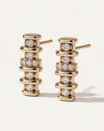 Linear Diamond Bar Drop Earrings from the side, showing the gold posts and the row of three diamonds at the center of each drop