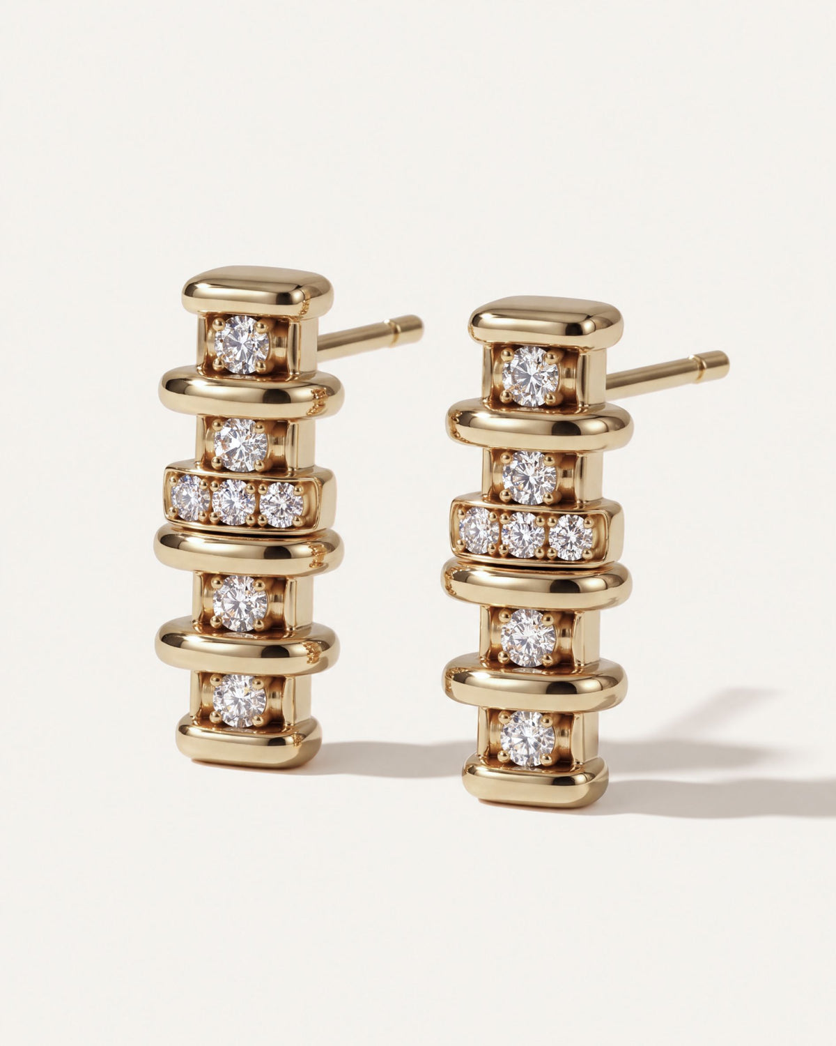 Linear Diamond Bar Drop Earrings from the side, showing the gold posts and the row of three diamonds at the center of each drop