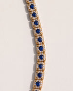 Close up of the Oval Sapphire Halo Bracelet, showing the oval sapphires running lengthways in diamond halo links