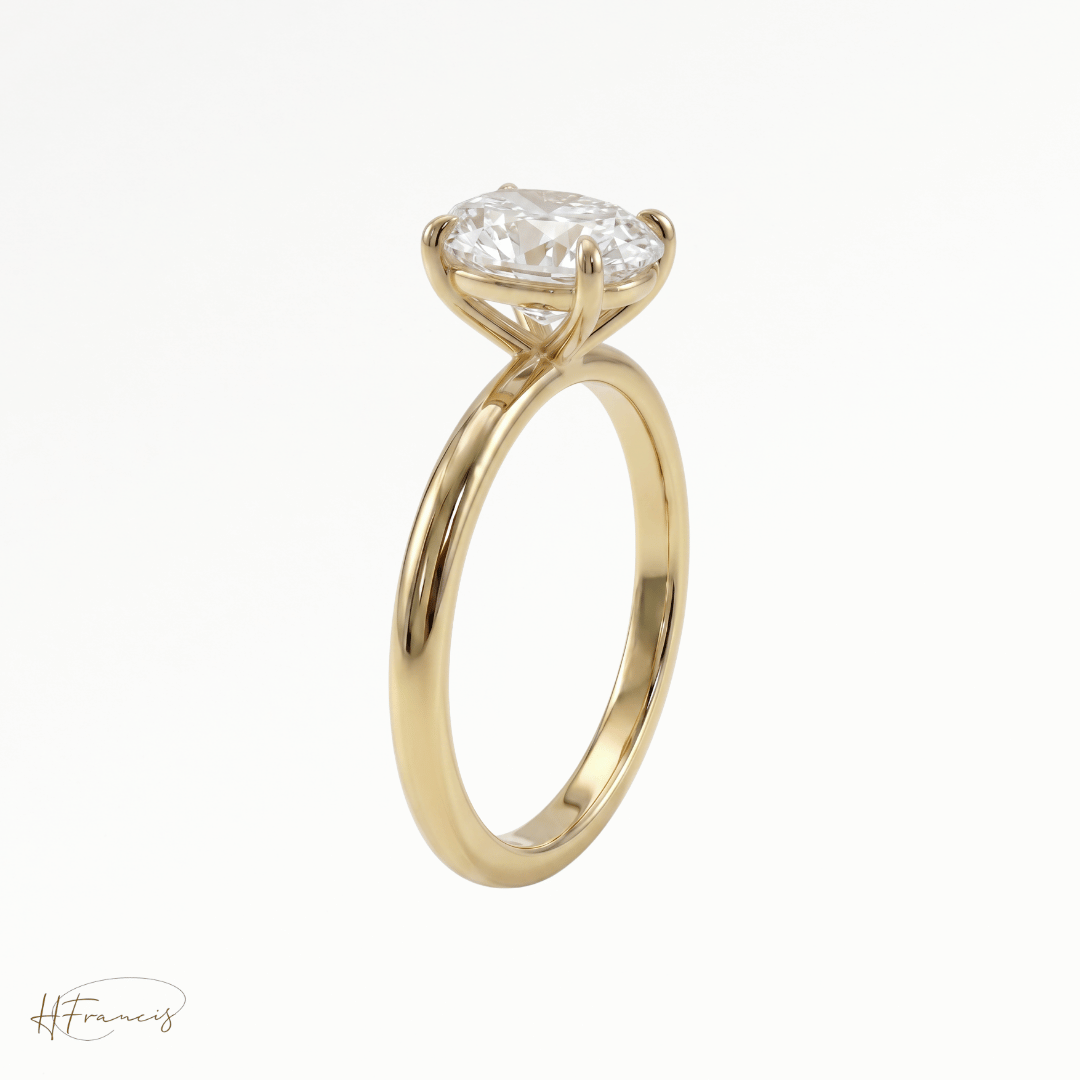 Oval classic solitaire engagement ring in 18k yellow gold side view 