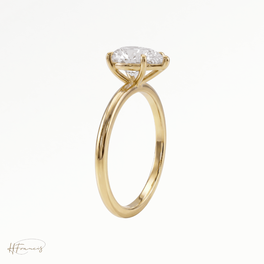 Pear classic solitaire engagement ring in 18k yellow gold side view 