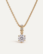 Sculpted Bail Round Pendant, a 2.5 carat round diamond in six prongs hanging from a gold bail set with diamonds, on a 14k gold cable chain