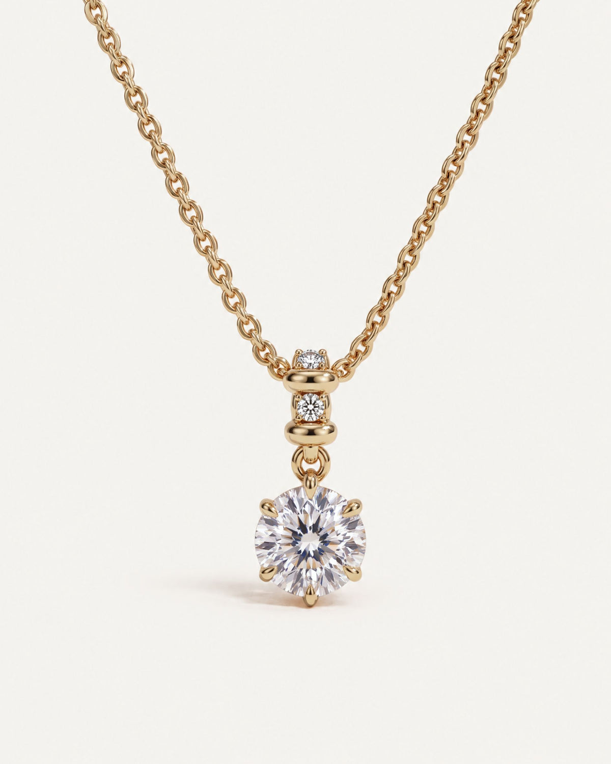 Sculpted Bail Round Pendant, a 2.5 carat round diamond in six prongs hanging from a gold bail set with diamonds, on a 14k gold cable chain