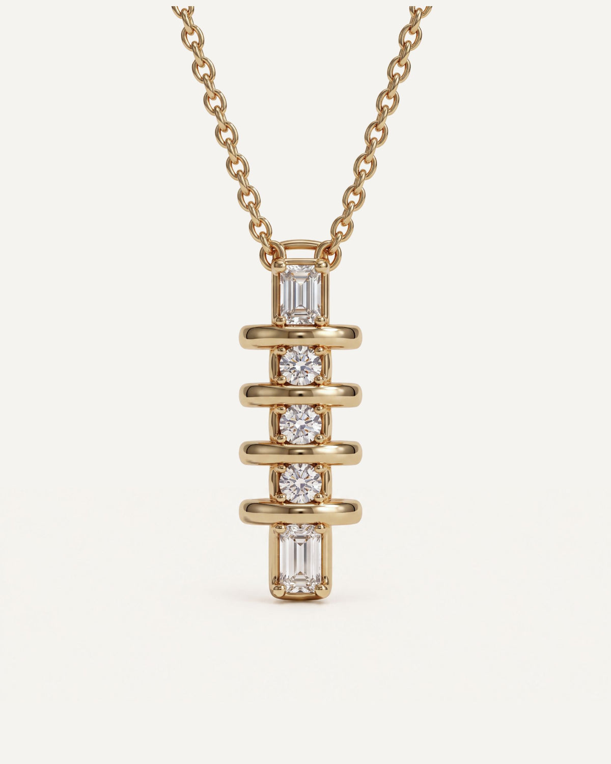 Emerald and Round Diamond Drop Pendant on a 14k gold cable chain, two emerald-cut diamonds and three round diamonds between polished gold bars