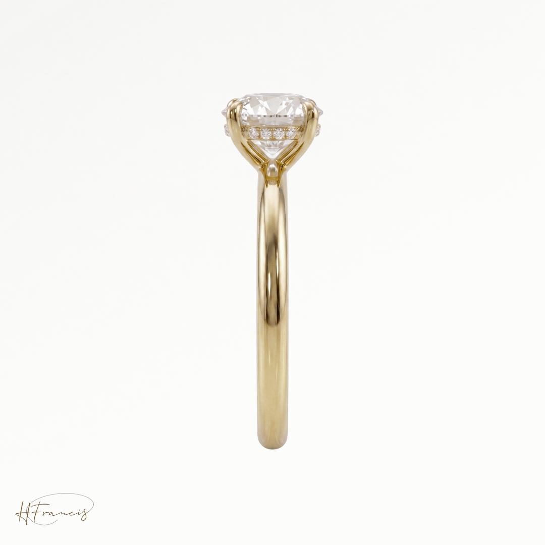 Round classic solitaire engagement ring in 18k yellow gold side profile 