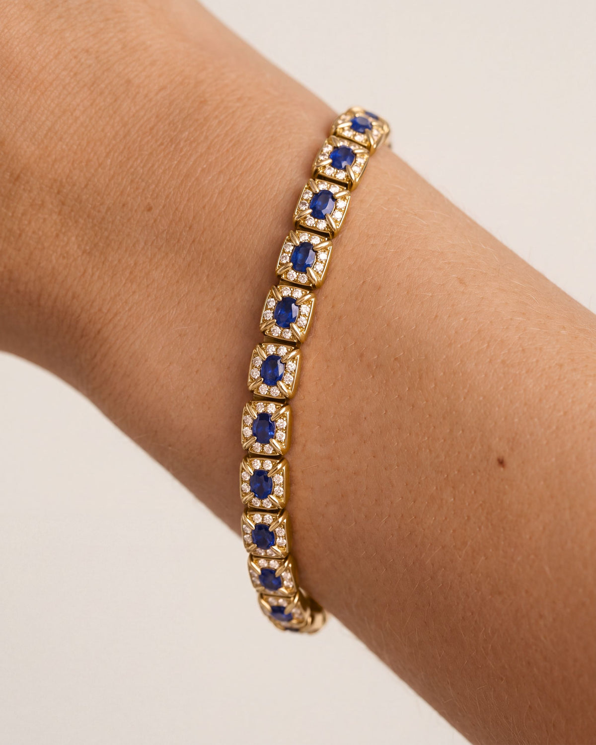Oval Sapphire Halo Bracelet worn on the wrist