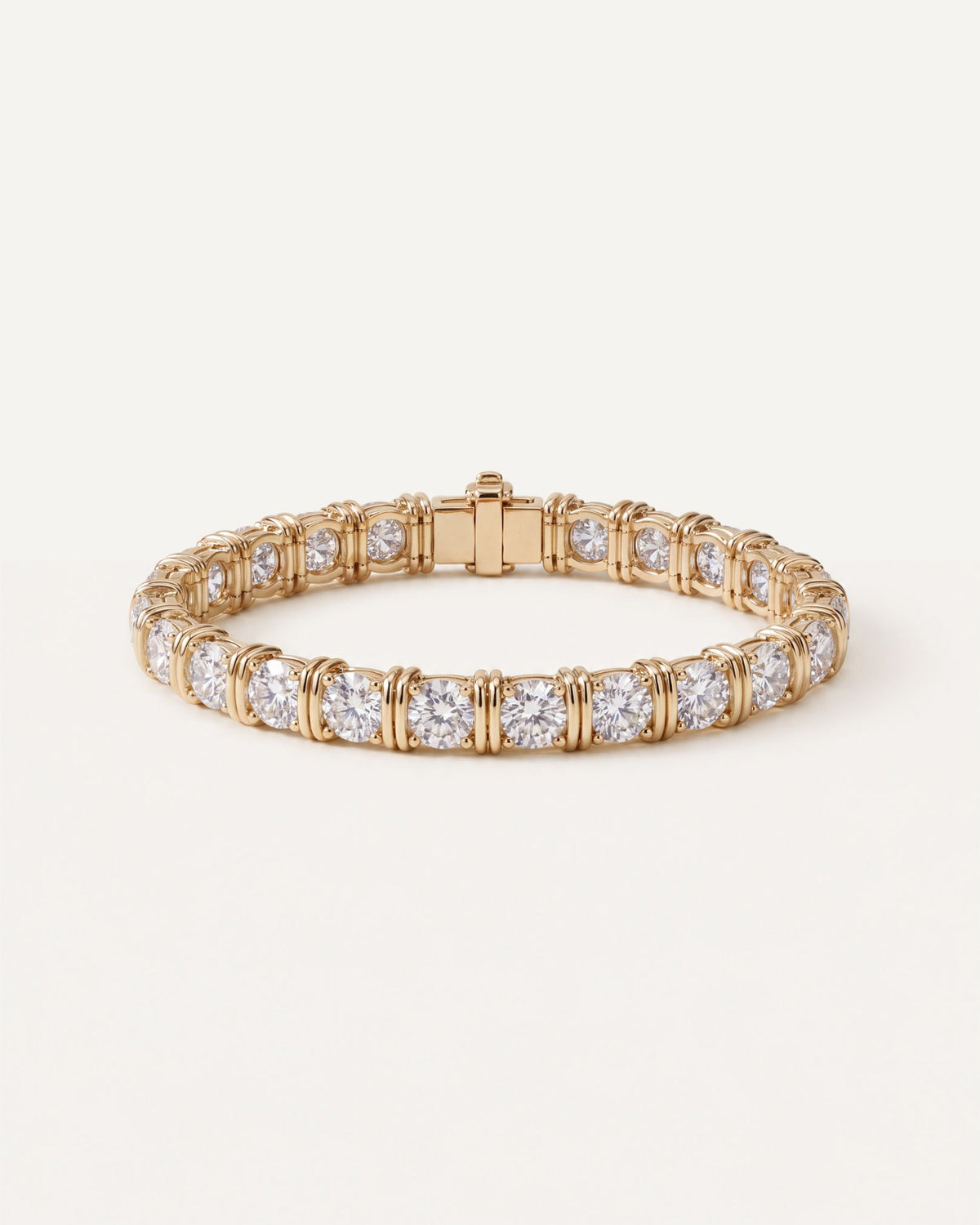 Dual Rail Diamond Tennis Bracelet in 14k yellow gold, fastened in a circle, round diamonds in four prongs with paired gold bars between each stone