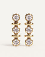 Tri-Diamond Drop Earrings in 14k yellow gold, three round diamonds in each earring, each in its own gold bezel