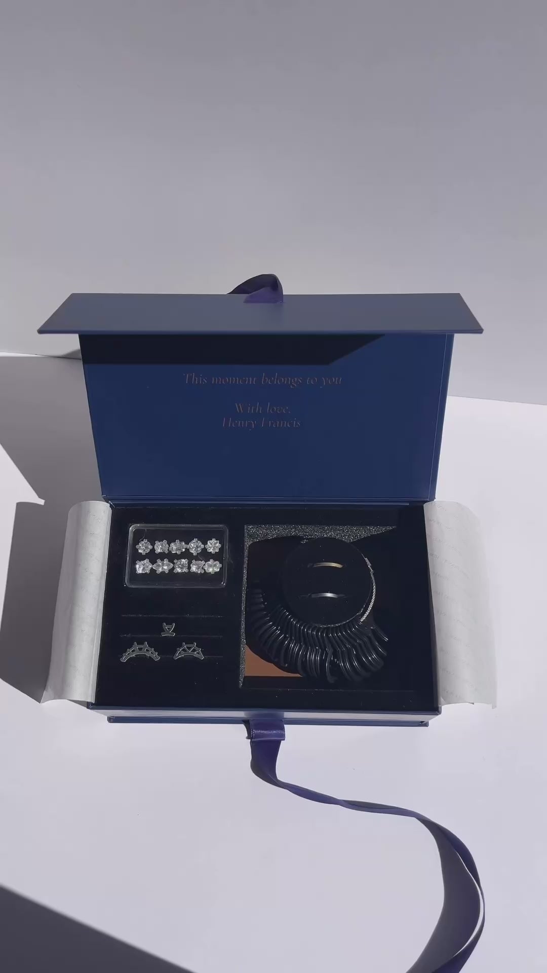 The Ring Try-On Kit opened to show the stones, setting styles, ring sizer and bands